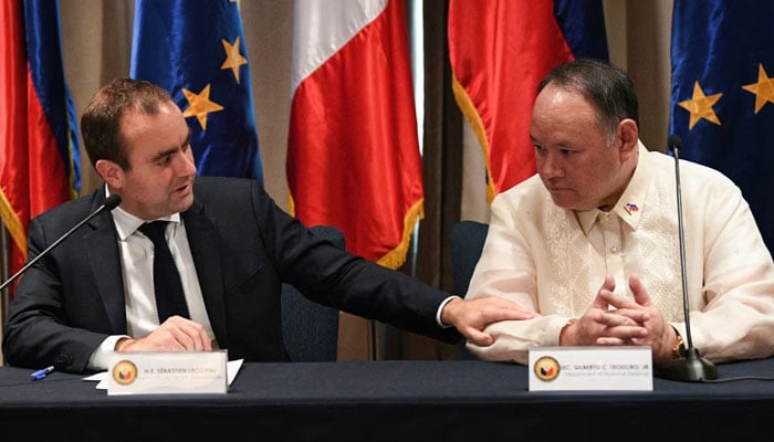 Frances Minister for the Armed Forces Sebastien Lecornu (L) speaks during a joint press conference with Secretary of National Defense of Philippines Gilbert Teodoro, at a hotel in Manila on December 2, 2023. —AFP