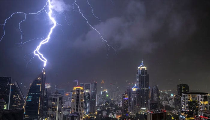 In this picture taken on October 27, 2019 lightening strikes on a building during a thunderstorm.  —AFP File