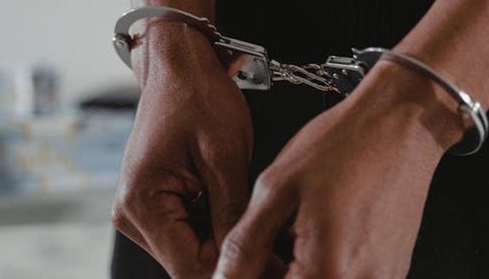 Representational image of a handcuffed man. — Pexels