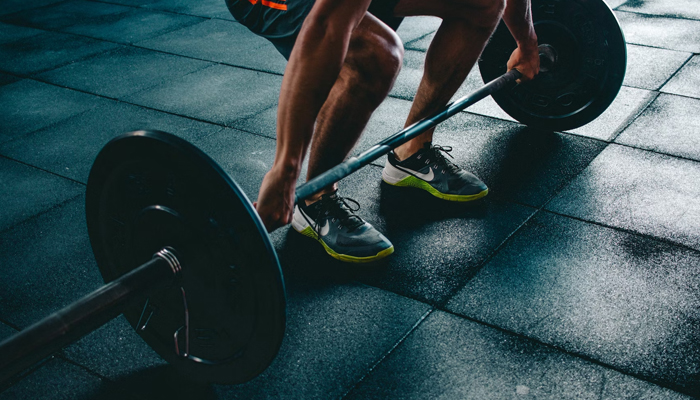 A representational image of a person pulling a weight. — Unsplash/File