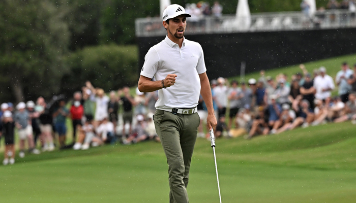Chilean Joaquin Niemann celebrates after sinking a putt to win the Australian Open golf tournament at The Australian Golf Club in Sydney on December 3, 2023. — AFP