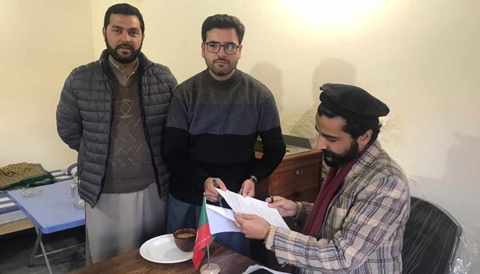 This image shows a candidate applying for the PTIs election ticket to the party official on December 3, 2023, in Mansehra. — Facebook/PTI Hazara