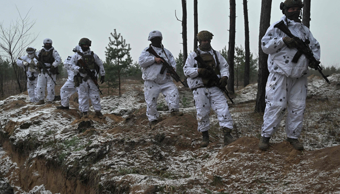 Ukrainian servicemen take part in military training in an undisclosed location in the Kharkiv region on December 1, 2023. — AFP
