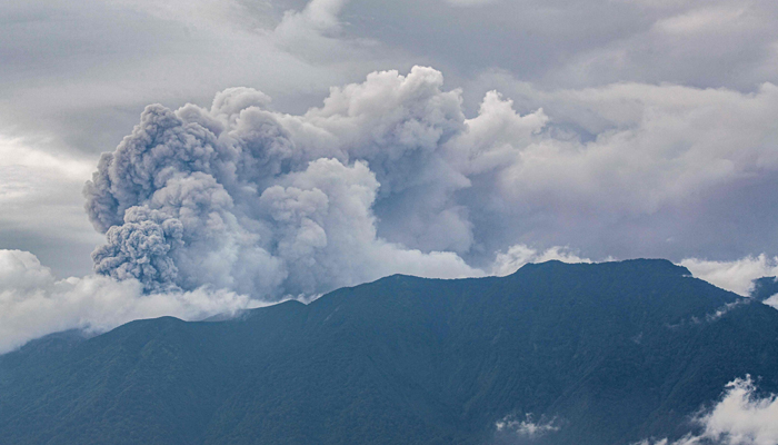 Volcanic ash spews from Mount Marapi during an eruption as seen from Tanah Datar in West Sumatra on December 3, 2023. — AFP
