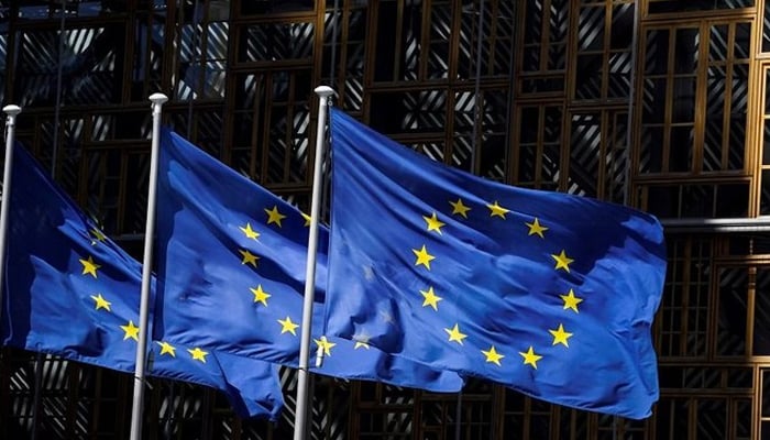 This picture shows the European Union flags fluttering outside the European Commission building in Brussels. — AFP/File