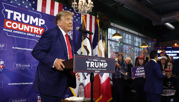 Republican presidential candidate former President Donald Trump speaks at a commit to caucus campaign event at the Whiskey River bar on December 02, 2023 in Ankeny, Iowa. — AFP