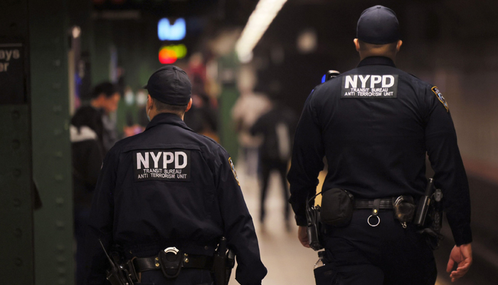 NYPD officers patrol the subway platform at the Atlantic Avenue subway station in the Sunset Park neighbourhood of Brooklyn in New York City, April 13, 2022. — AFP