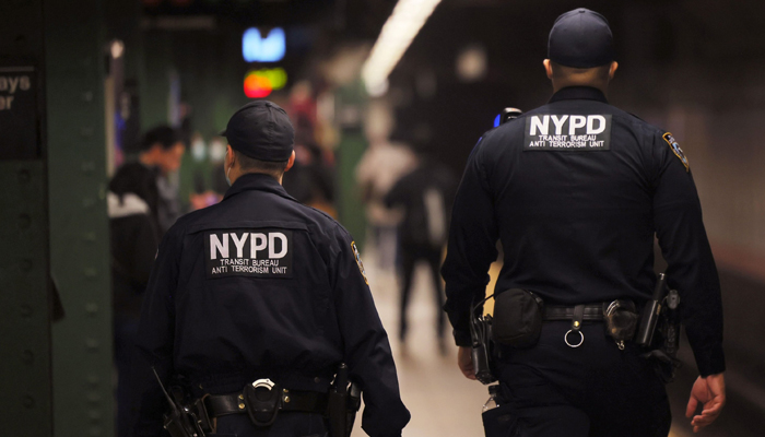 NYPD officers patrol the subway platform at the Atlantic Avenue subway station in the Sunset Park neighbourhood of Brooklyn in New York City, April 13, 2022. — AFP