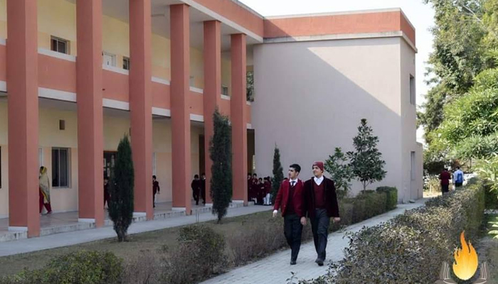 This image shows students walking inside the building of Ghulam Ishaq Khan Institute of Engineering Sciences College. — GIKI website