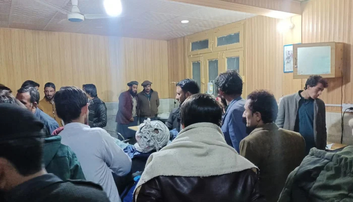 People can be seen at a hospital following the attack on a bus in Chilas on December 2, 2023. — By reporter Muhammad Ali