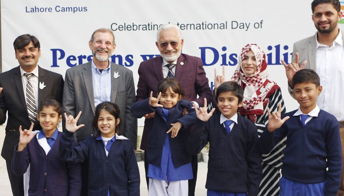 In this picture, Provincial Caretaker Minister of Health, Social Welfare, and Bait ul Mal Prof Dr. Javed Akram (c) stands and holds a child in his hands on December 4, 2023.— Facebook/Javed Akram