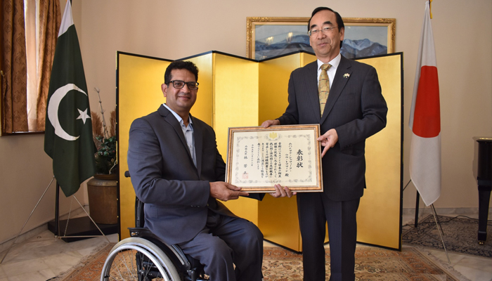 The Japanese ambassador to Pakistan, H.E. WADA Mitsuhiro confers the Foreign Minister’s commendations for the year 2023 upon Muhammad Shafiq ur Rehman (L) in this picture released on December 4, 2023. — Facebook/Embassy of Japan in Pakistan