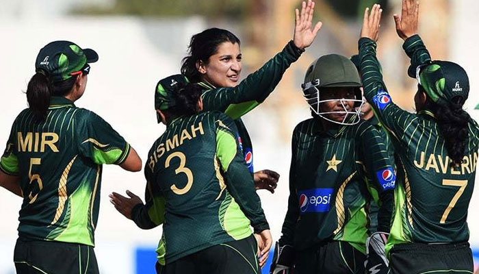 Pakistan women cricketers celebrate after taking a wicket. — AFP/File