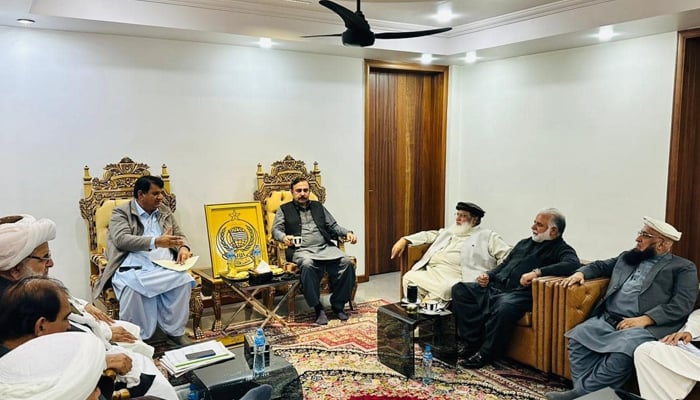 A delegation of the PMLN consisting of central leaders, including Tariq Fazal Chaudhry (C), Murtaza Javed Abbasi (2nd-R) and Engineer Amir Muqam visit the provincial headquarters of the JUIF on December 6, 2023. — Facebook/Murtaza Javed Abbasi