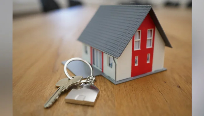 This representational image shows a key and a dummy house. — Unsplash/File