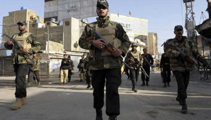 A representational image of security forces personnel standing guard. — AFP/File