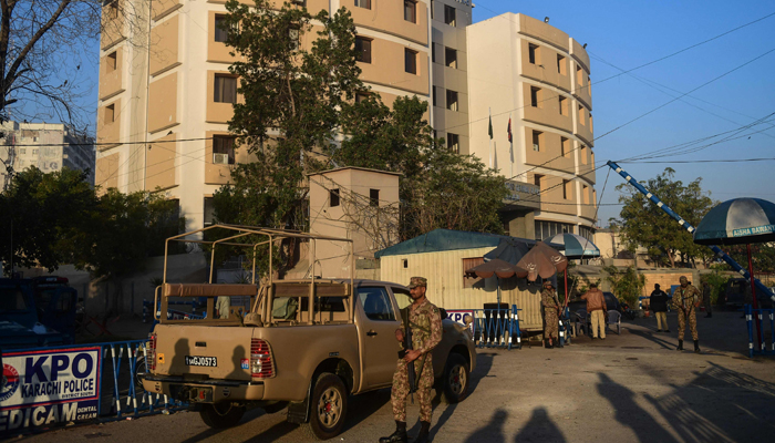 Army soldiers stand guard outside the Karachi Police Office compound a day after an attack by terrorists in Karachi on February 18, 2023. — AFP