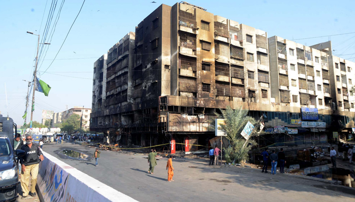 View of a multi-storey building after fire eruption incident at Furniture Market in a residential building, near Ayesha Manzil in Karachi on December 7, 2023. — PPI