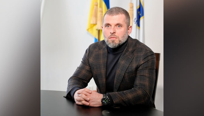 Acting sports minister, Matviy Bidnyi sits in an office on February 17, 2023. — Facebook/Матвій Бідний