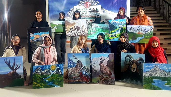 This image shows the painters showing their paintings on mountain ecosystems and endangered species in Pakistan Mountain Festival on December 5, 2023. — Facebook/Pakistan Mountain Festival