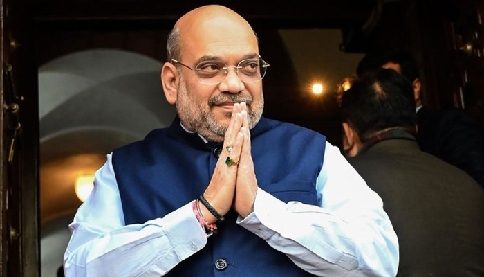 This photo shows Indias Home Minister Amit Shah gesturing as he arrives at the Parliament House in New Delhi. — AFP/File