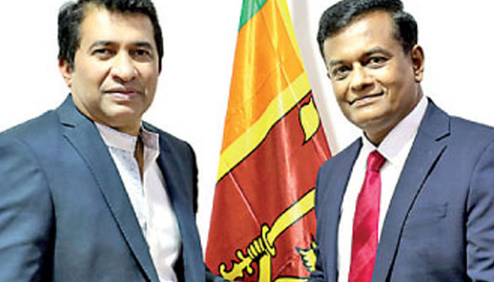 New Director General of Sports Dr. Shemal Fernando (right) receives his letter of appointment from Sports and Youth Affairs Minister Roshan Ranasinghe. . — AFP File