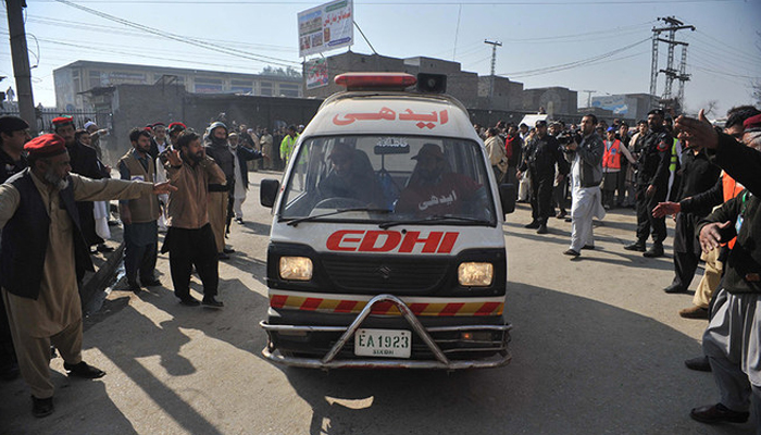 This image shows people directing an ambulance. — AFP/File