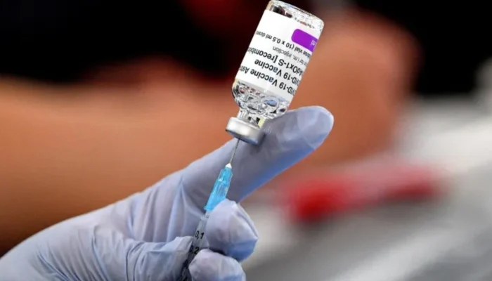A paramedic preparing a dose of a vaccine inside a Buddhist temple in a suburb in Sydney — AFP/File