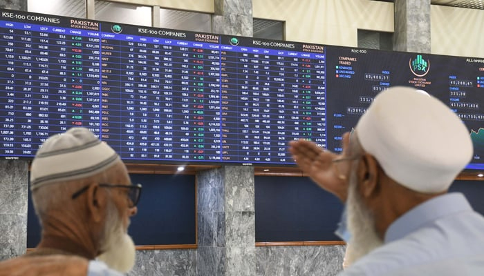 Pakistani stockbrokers monitor the share prices during a trading session at the Pakistan Stock Exchange on November 28, 2023. — Online