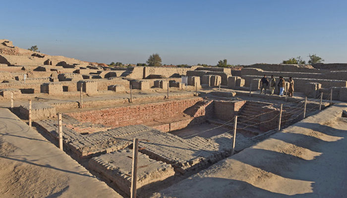 Visitors walk through the UNESCO World Heritage archaeological site of Mohenjo Daro in Sindh. — AFP
