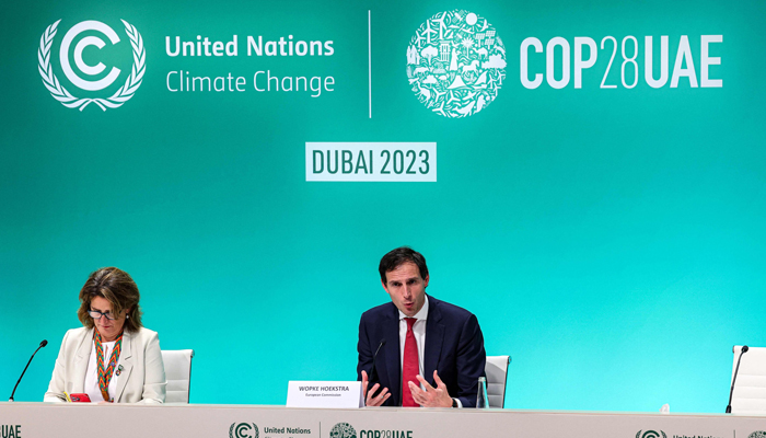 EU Commissioner for Climate Action Wopke Hoekstra (R) and Spains Minister of Ecological Transition Teresa Ribera (L), whose country holds the EUs rotating presidency, attend a press conference at the UN climate summit in Dubai on December 6, 2023. — AFP
