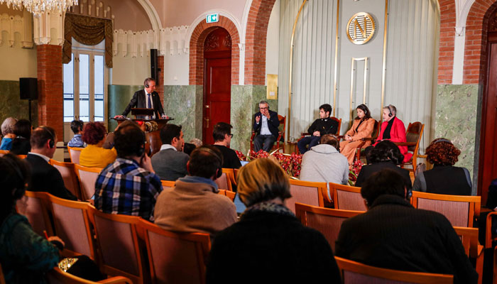 The Head of the Norwegian Nobel Committee Berit Reiss-Andersen (R) gives a press conference with the husband and children of this years winner of the Nobel Peace Prize, Iranian human rights activist Narges Mohammadi (not in picture), with (from L) her husband Taghi Rahmani and their children Ali and Kiana, at the Nobel Institute in Oslo, Norway, on December 9, 2023. — AFP