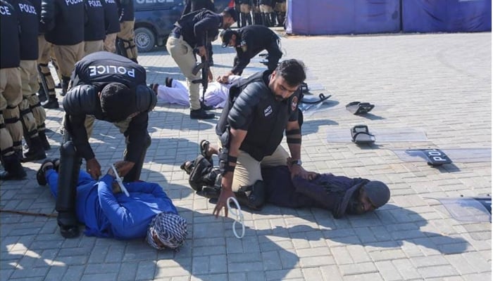 Personnel of the Anti-Encroachment Force perform a drill during a four-week Anti-Riot Drill and Weapon Refresher Course at the Special Security Unit Chowkandi Headquarters on December 8, 2023. — Facebook/SSU Sindh Police