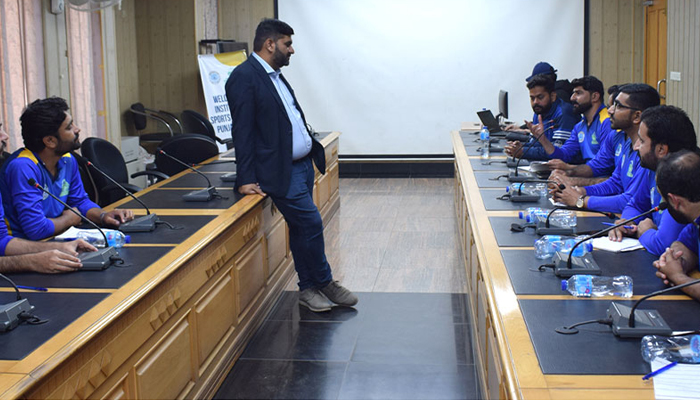 This image shows a trainer interacting with athletes during the week-long training course of Punjab’s divisional coaches on December 8, 2023. — Facebook/Sports Board Punjab