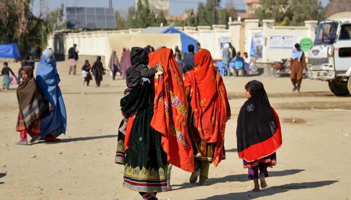 Afghan refugees arrive from Pakistan at the Afghanistan-Pakistan border in Spin Boldak district of Kandahar province on December 3, 2023. — AFP