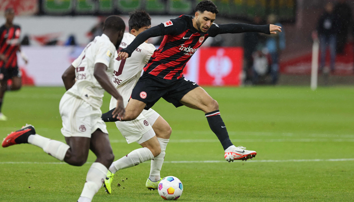 Frankfurts Egyptian forward Omar Marmoush vies for the ball during the German first division Bundesliga football match between Eintracht Frankfurt and FC Bayern Munich in Frankfurt, western Germany on December 9, 2023. — AFP