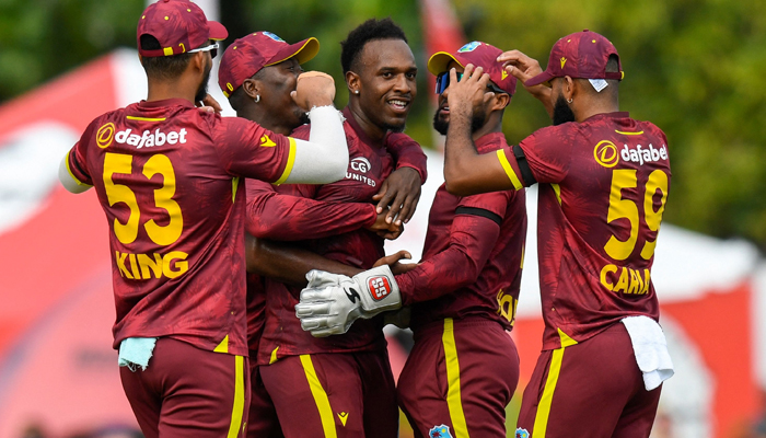 Matthew Forde (C) of the West Indies celebrates with teammates the dismissal of Will Jacks (R) of England during the third and final ODI at Kensington Oval, Bridgetown, Barbados, on December 9, 2023. — AFP