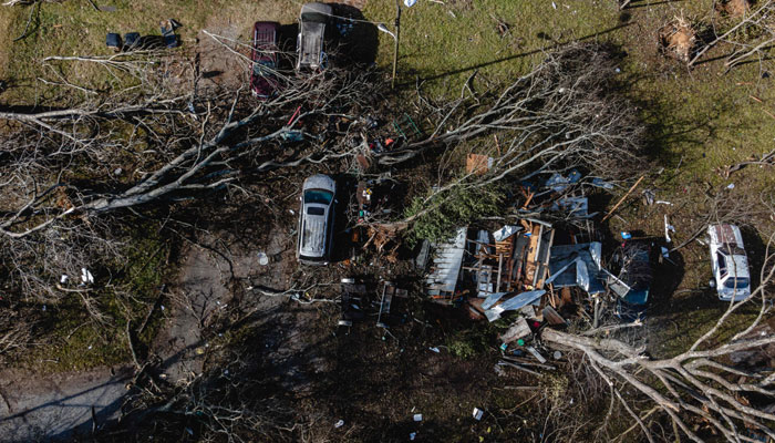 In an aerial view, downed trees and a destroyed home are seen in the aftermath of a tornado in Madison, Tennessee on December 10, 2023. — AFP