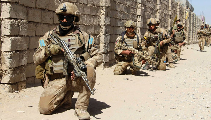 Afghan National Army commandos take position during a military operation. — AFP/File