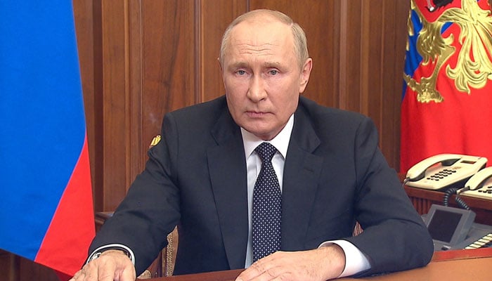 The picture released on September 21, 2022, by the Kremlin shows Russian President Vladimir Putin speaking during a televised address to the nation in Moscow. — AFP