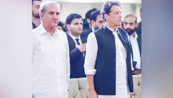 This picture released on September 14, 2023, shows Vice Chairman PTI Shah Mehmood Qureshi (left) and former PM Imran Khan during a public ceremony. — Facebook/Shah Mahmood Qureshi