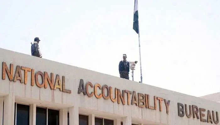 This image shows security personnel standing on the roof of the National Accountability Bureau building in Islamabad. — Online/File