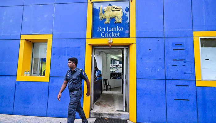 A security personnel walks out from the national cricket board office in Colombo on Dec 13, 2023.— AFP
