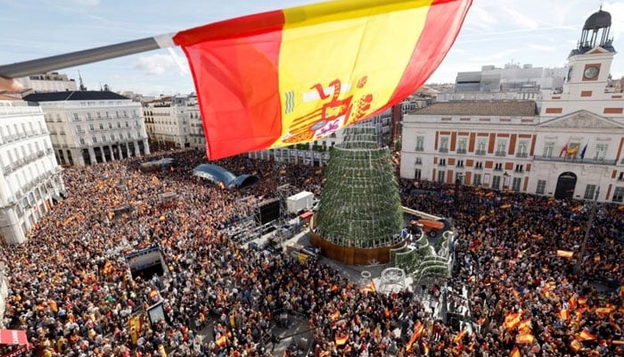 In this undated photo, huge crowd of protesters can be seen hitting the streets in Spain. . — AFP File