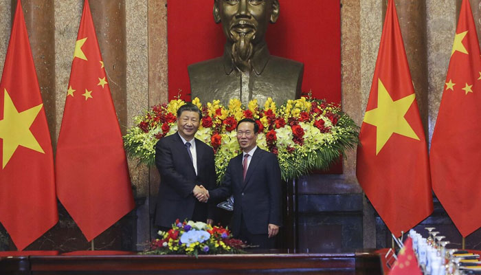 Xi Jinping and Vo Van Thuong during a meeting at the Presidential Palace in Hanoi on Dec. 13. . — AFP File