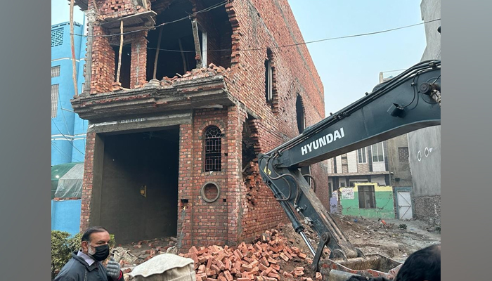 This image shows LDA personnel conducting an anti-encroachment operation on December 13, 2023. — Facebook/Lahore Development Authority