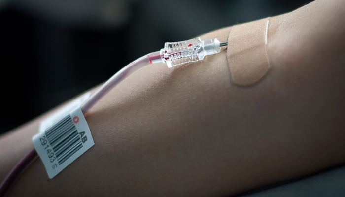 A woman donates blood. — AFP/File