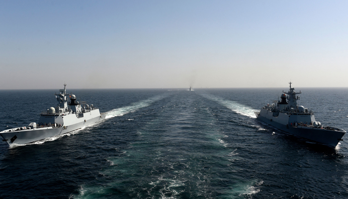Pakistan Navy Ship (PNS) Taimur (L) and Tughril (R) take part in the multinational naval exercise AMAN-23 in the Arabian Sea near Karachi on February 13, 2023. — AFP