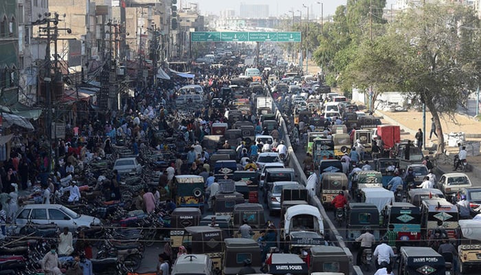 This representational image shows commuters in a traffic jam on a street in Karachi. — AFP/File
