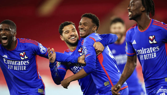 Lyons Jeffinho (C) celebrates with teammates after scoring the winner against Monaco. — AFP File